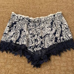 Blue and white shorts with lace trim
